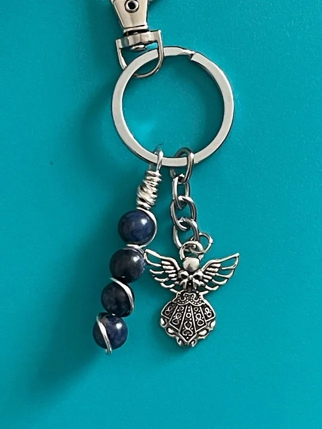 Elevate your keys with the Blue Sodalite Crystal Beads Key Chain from KJsKrystals, a stylish and protective accessory.