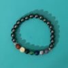 Adorn your wrist with the captivating Chakra Bracelet featuring Hematite Beads, available at KJsKrystals, LLC, and experience the harmonious blend of chakras and hematite's grounding energy.