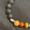 Elevate your style with the Chakra Bracelet adorned with Lava Beads and Barrel Spacers from KJsKrystals, LLC, a spiritually grounding and stylish gemstone accessory.