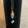 Explore the world of gemstones with the Guatemala Jade Oval Necklace, a captivating choice for jewelry enthusiasts at KJsKrystals, LLC.