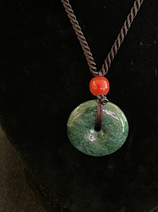 Create a stunning fashion statement with the Guatemala Jade Circle Necklace, available at KJsKrystals, LLC, and experience its unique appeal.